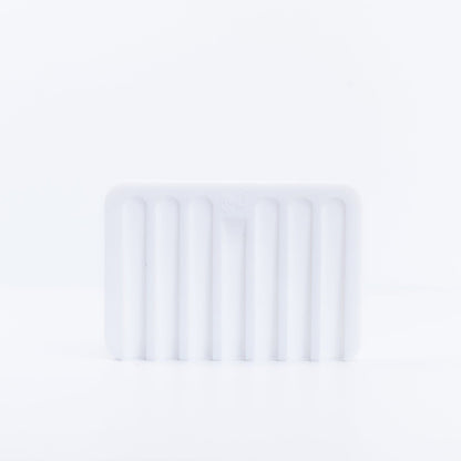 One White Silicone Soap Dish placed on its side